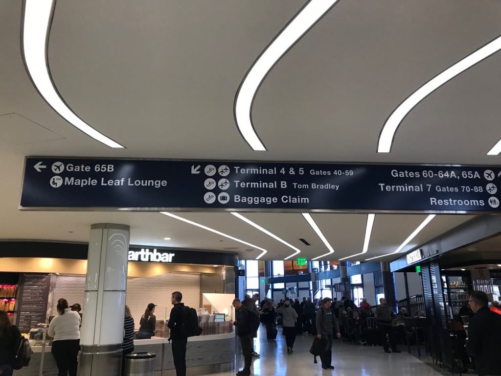 Inside airport with signage